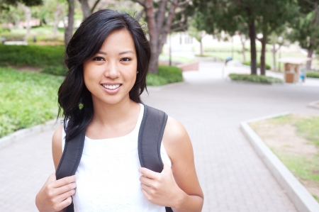portrait of a pretty Asian college student on campusの写真素材