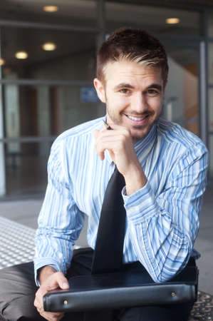 portrait of a handsome young businessman outsideの写真素材