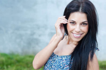 Portrait of pretty young woman in a parkの写真素材