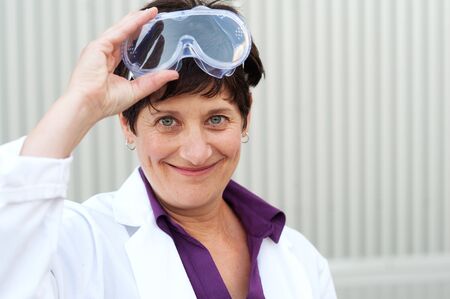 portrait of a mature scientist wearing safety gogglesの写真素材
