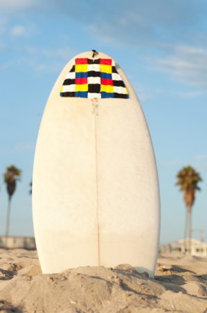 surfboard in the sand on the beachの写真素材