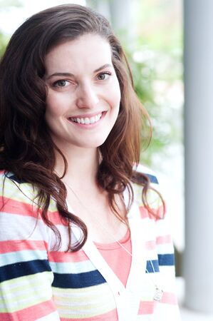 portrait of a pretty college student on campus