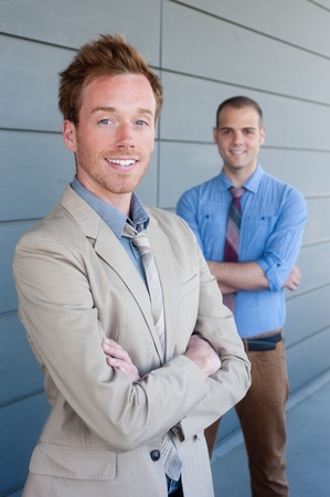 portrait of two young handsome businessmen shot on locationの写真素材