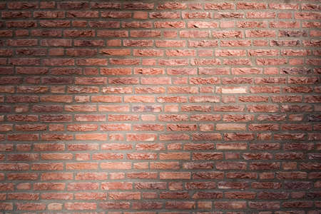 Flush jointed brickwork in dramatic light. Made of antique-looking bricks (possibly dry moulded) in...