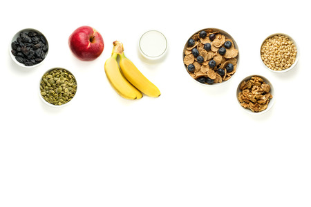 Healthy food. Fruits, multi grain flakes with blueberry and milk for breakfast. Top view with space for text.の写真素材