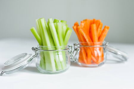 Healthy diet food. Carrots and celery chopped with chopsticks.の写真素材