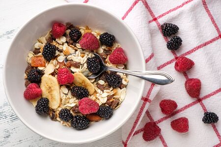 oat flakes with berries and dried fruitsの写真素材