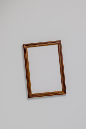 Empty brown wood border for photography, with craft paper isolated on white table background. Top view, flat lay.の写真素材