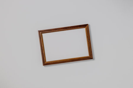 Empty brown wood border for photography, with craft paper isolated on white table background. Top view, flat lay.の写真素材