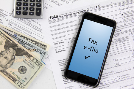 e-file taxes with mobile phoneの写真素材