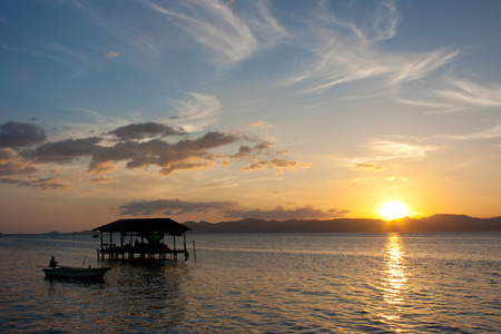 house in sunset at seaの写真素材