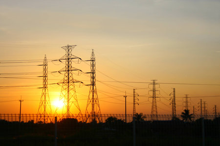 transmission power line on sunsetの写真素材