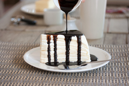 Pour sauce into cheesecakeの写真素材