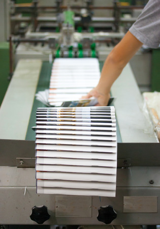 Print shop - Finishing line  Post press finishing line machine  cutting, trimming, paperback の写真素材