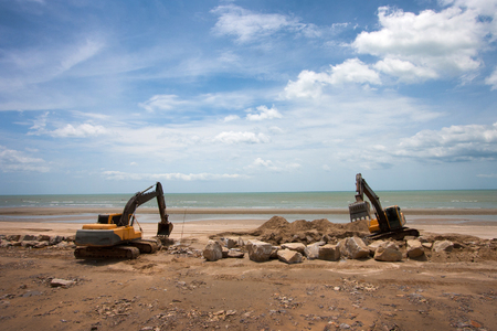excavator machine doing earthmoving work at sand quarryの写真素材