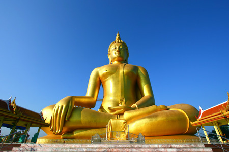 big golden Buddha statue with a blue sky, Thailandの写真素材