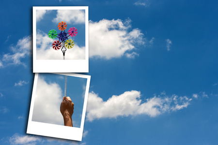 Photo frame on blue sky backgroundの写真素材