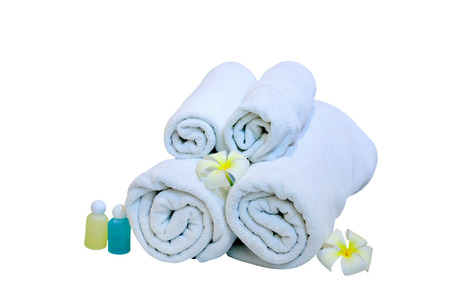 rolled up white beach towelの写真素材