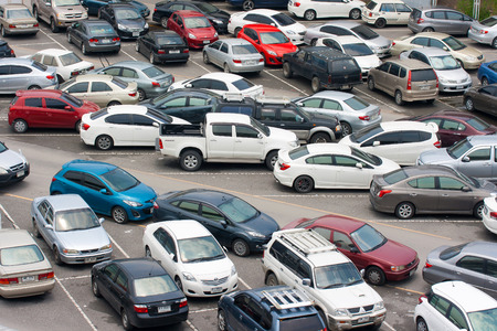 BANGKOK - AUG 23: Cars parked at a park and side lot at a BTS station in Chatuchak district on AUG 23, 2014 in Bangkok, Thailand. The government has promoted park and ride to reduce traffic congestion.のeditorial素材