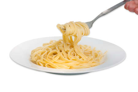 pasta on fork isolated against white.の写真素材
