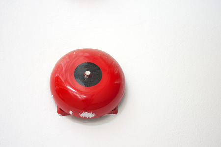 Fire alarm on white wall backgroundの写真素材