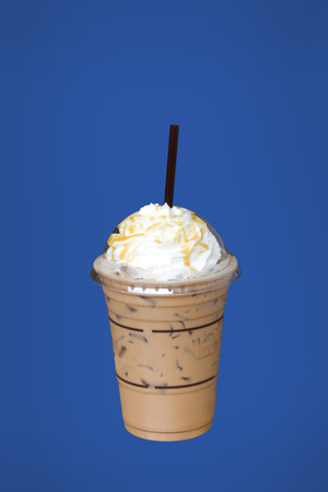 a cup of coffee isolated on blue backgroundの写真素材