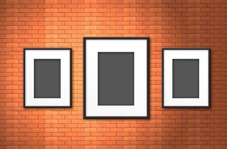 blank photo frame on old brick wallの写真素材