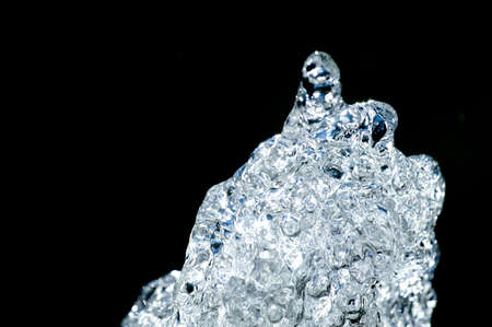 Water splash, isolated on black backgroundの写真素材