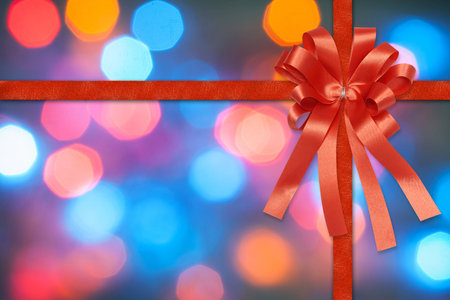 Red Christmas Ribbon on bokeh backgroundの写真素材