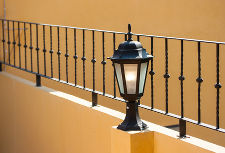 old italian lamp on colour wallの写真素材