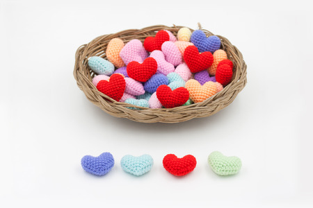 Colorful Yarn hearts in the basket.の写真素材
