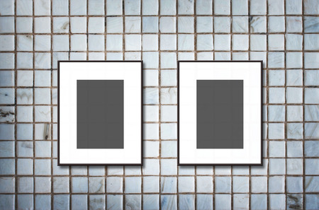 blank photo frame on Mosaic Tiles wallの写真素材