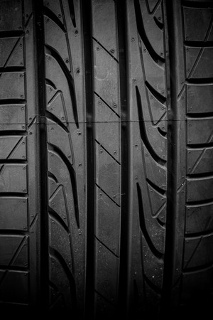 Winter tires close-up on black backgroundの写真素材