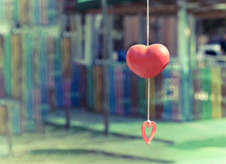 red heart mobile with blured background - vintage effect styleの写真素材