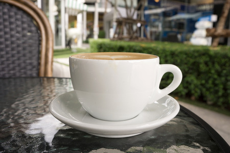 Coffee cup in coffee shop - vintage style effect pictureの写真素材
