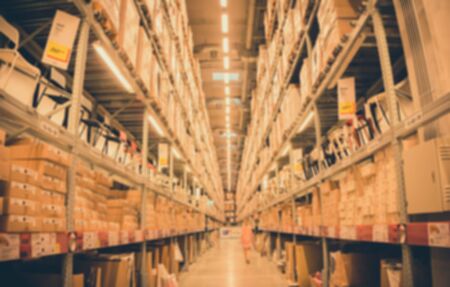 Blur image of a warehouse with multi layer shelves background - vintage filter effectの写真素材