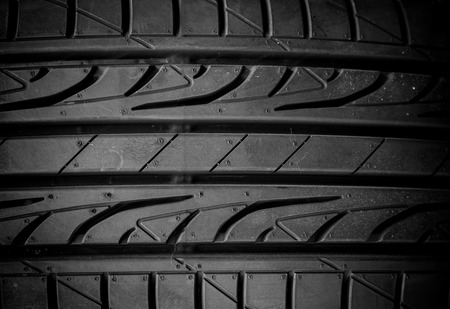 Winter tires close-up on black backgroundの写真素材