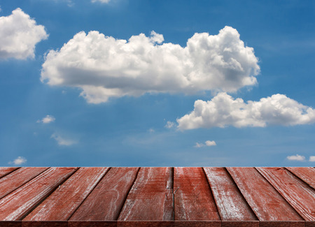 Wood table top on blue sky & cloud background can put or montage your products for display - summer conceptsの写真素材