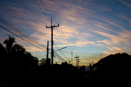 transmission power line on sunset skyの写真素材