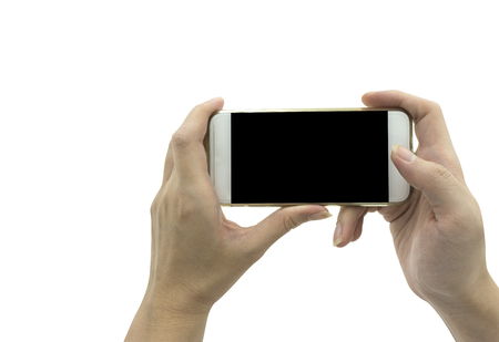 Female Hand holding smart phone isolated over white background - mockup templateの写真素材