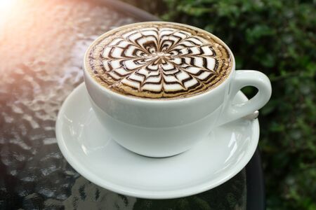 A cups of mocha coffee on table and sunlightの写真素材