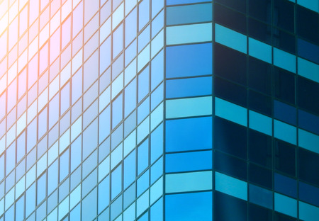 Close up of blue modern office building.