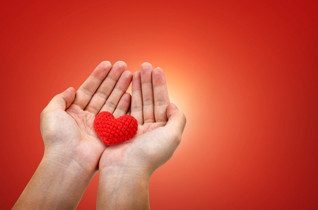 Hands hold red hearts - Valentines Day concept design.の写真素材
