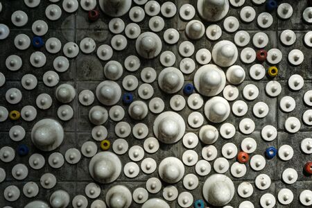 The wall is made of white ceramic. A ceramic is an inorganic, non-metallic, solid material comprising metal.の写真素材