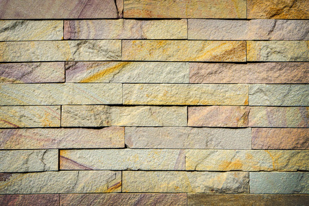 Yellow brick wall texture background, A wall is a structure that defines an area, carries a load, or provides shelter or security. There are many kinds of walls:の写真素材