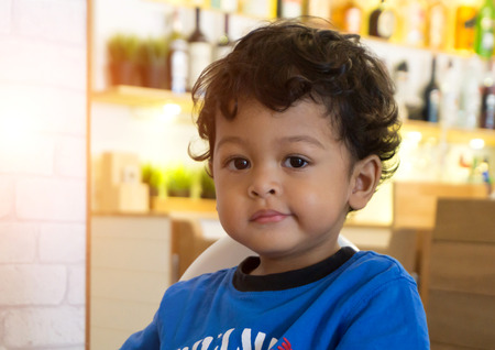 2 year old asian baby boy smile and happiness emotion face or asian kid in blue shirt.の写真素材