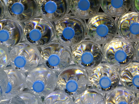 Close Up on mineral water bottles in top view.の写真素材