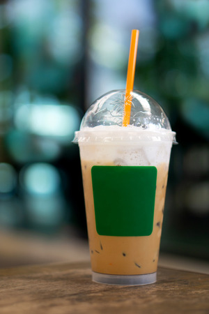 Cappuccino iced Coffee in plastic cup for takeaway mockup template.の写真素材