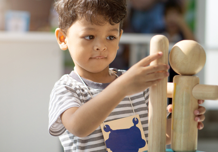 Asian little boy playing with wood toys.の写真素材