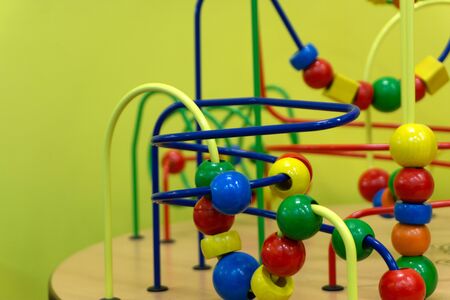 Educational wooden Logic toy with paths in Toddler baby in nursery room.の写真素材